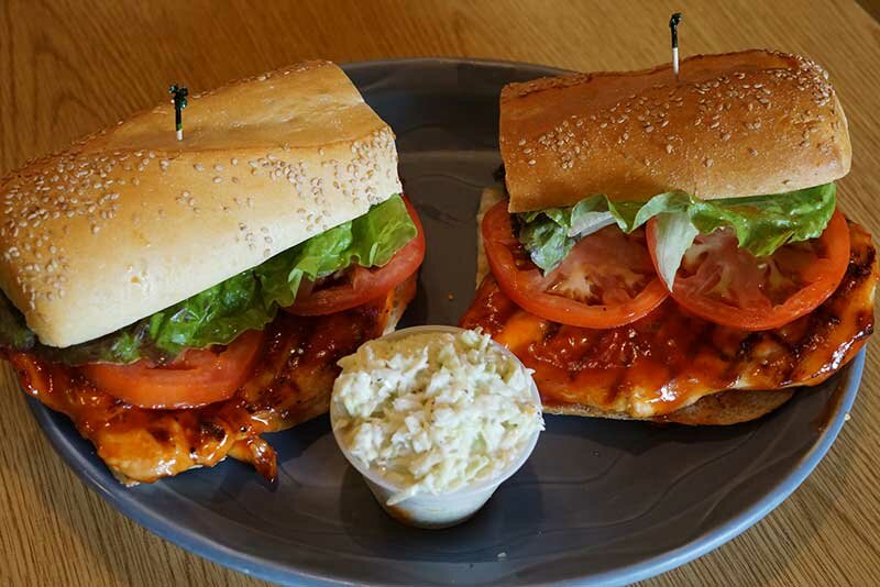 Grilled chicken sandwich with side of coleslaw